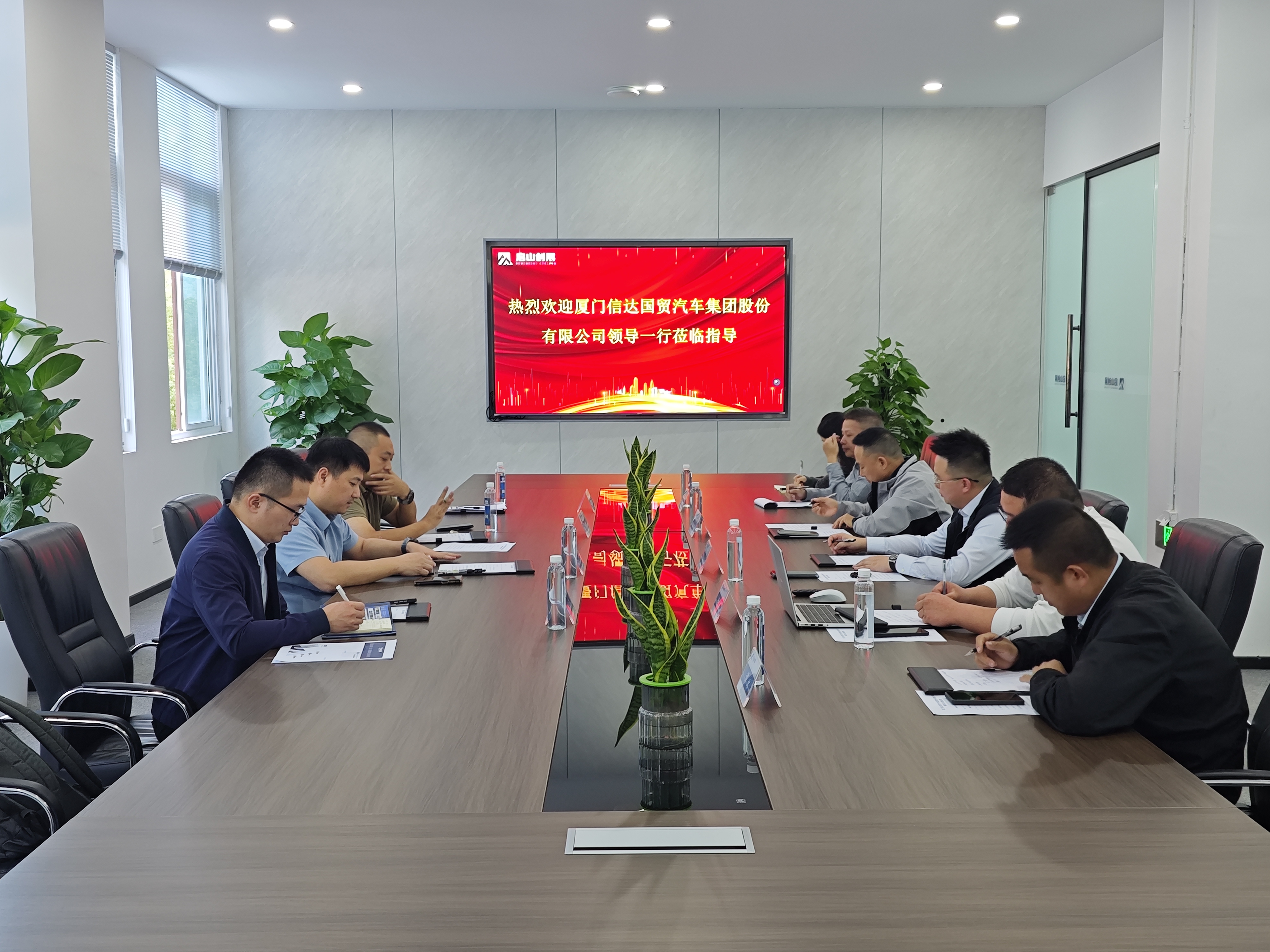 信达国贸汽车到访启山创展，共商新能源后市场合作新路径